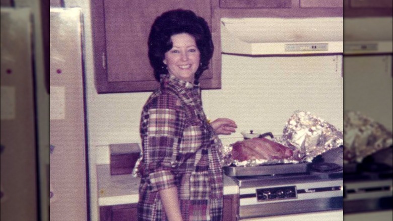 Paula Deen smiling with turkey