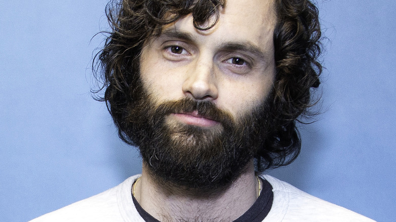 Penn Badgley with a bushy beard