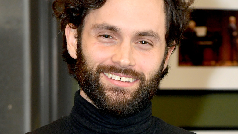 Penn Badgley with a big smile