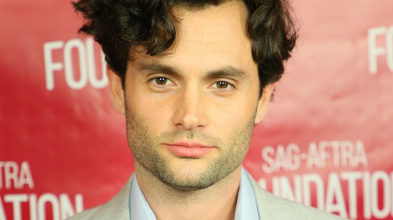 Penn Badgley with his head tilted