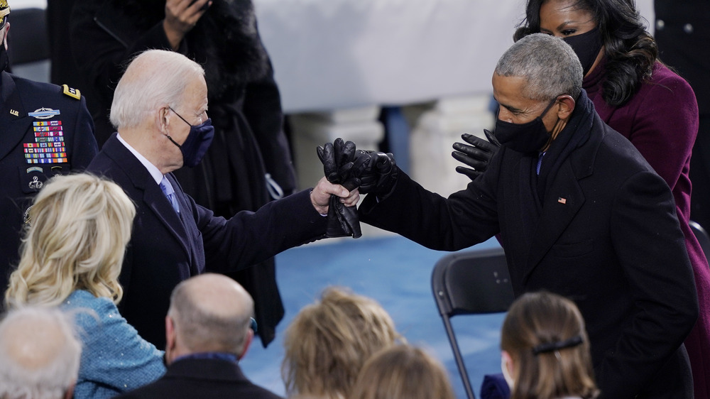 Barack Obama and Joe Biden fist bumping