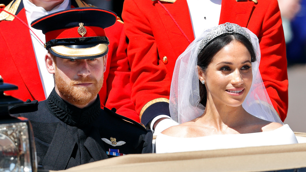 Prince Harry and Meghan Markle in a car on wedding day