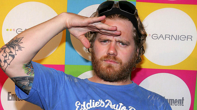 Ryan Dunn posing and giving a salute 