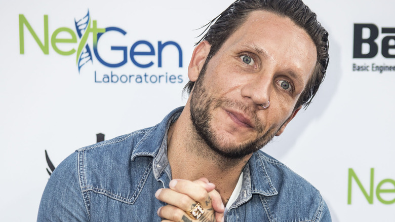 Brandon Novak, posing with hands clasped