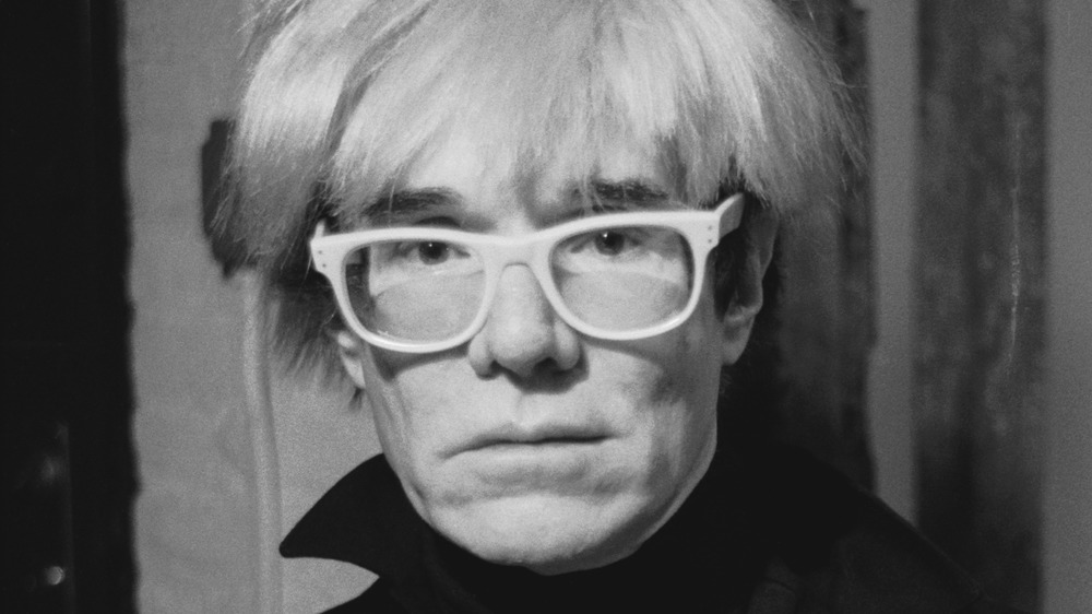 Andy Warhol posing