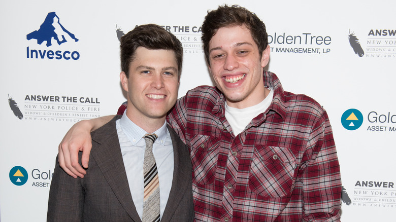 Pete Davidson and Colin Jost smiling for a picture