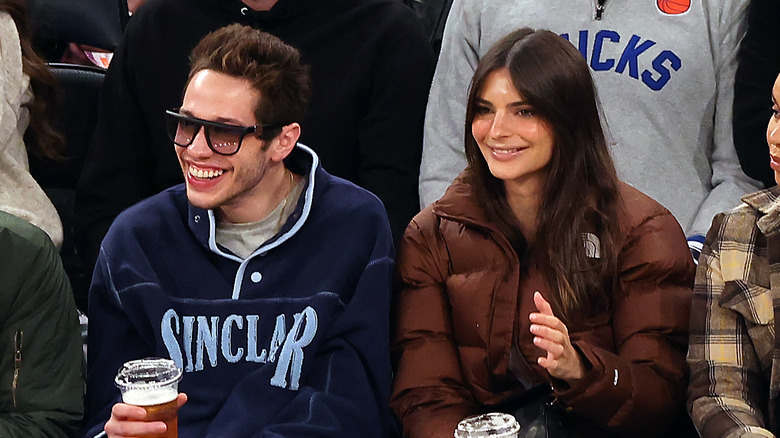 Pete Davidson and Emily Ratajkowski watching a basketball game