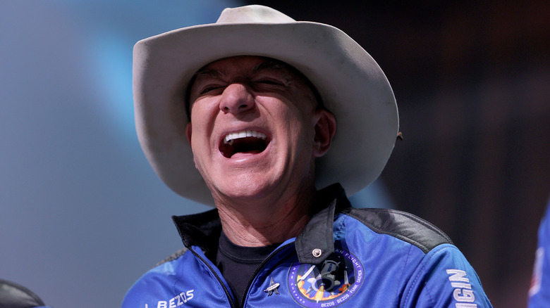 Jeff Bezos speaks about his flight on Blue Origin's New Shepard into space while wearing cowboy hat