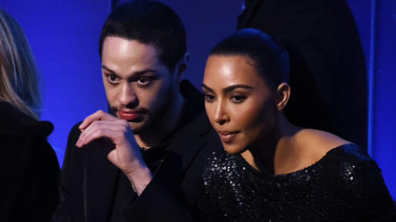 Pete Davidson and Kim Kardashian watch something