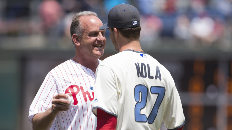 A.J. Nola and son at an event 