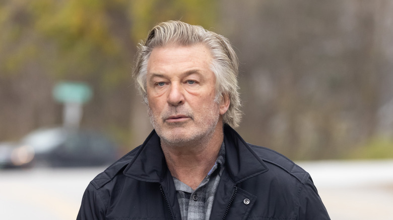 Alec Baldwin long hair black jacket