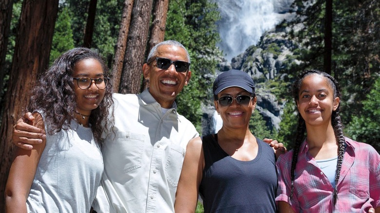 The Obama family in front of waterfall