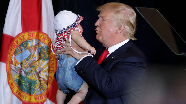 Donald Trump holding baby