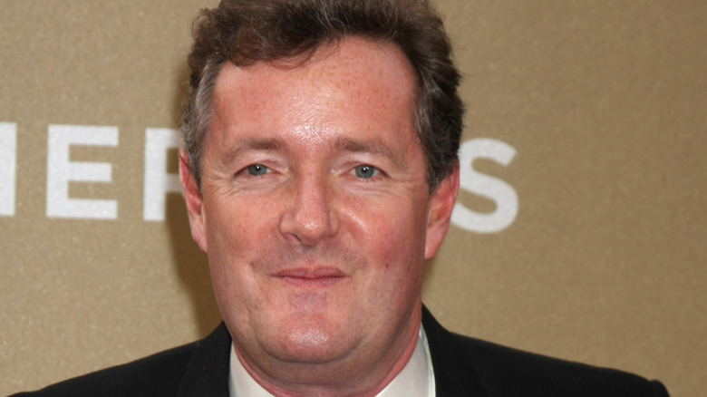 Piers Morgan smiling at an event