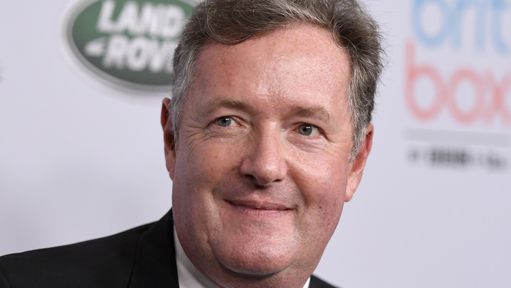 Piers Morgan smiling slightly