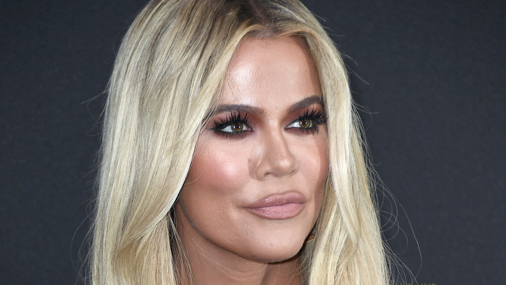 Khloe Kardashian poses at an event