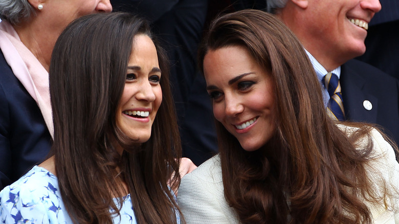 Pippa and Kate Middleton laugh