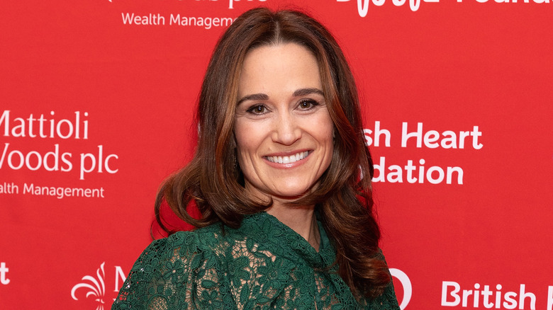 Pippa Middleton smiles in a green dress