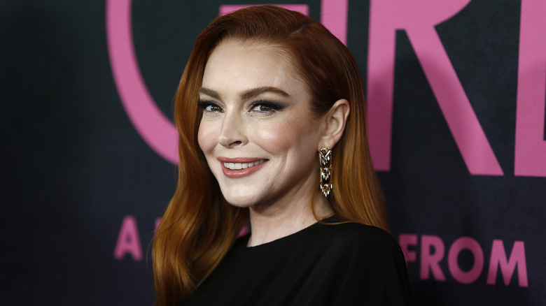 Lindsay Lohan smiles looking sideways