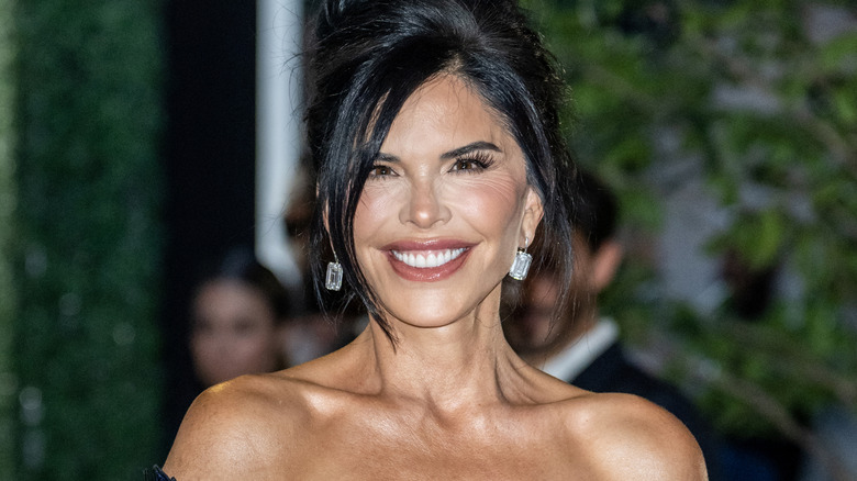 Lauren Sanchez poses with hair hair up and long bangs