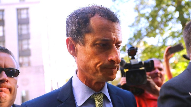 Anthony Weiner frowning, looking down