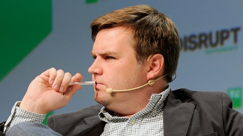 J.D. Vance with pen on lips