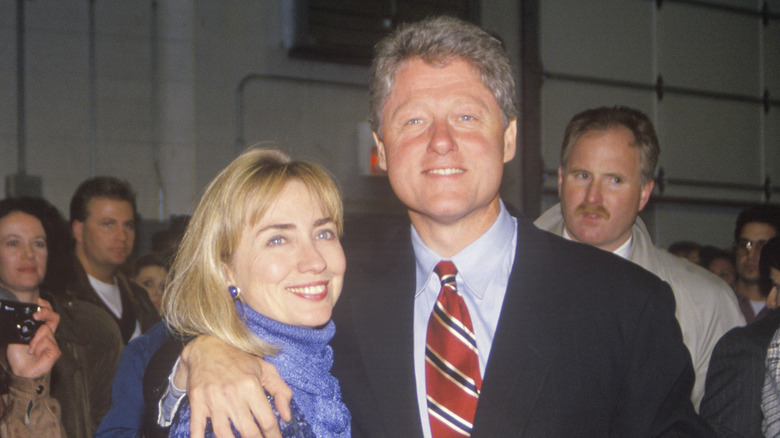 Bill Clinton posing with Hillary Clinton