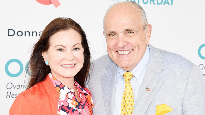 Rudy Giuliani posing with Judith Nathan