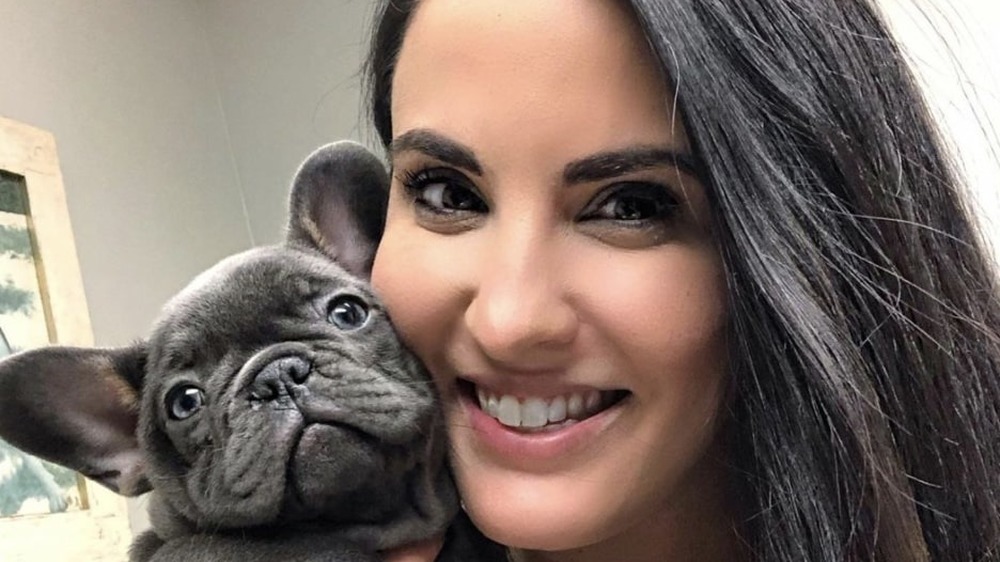 Dr. Jackie Dueñas holding a dog