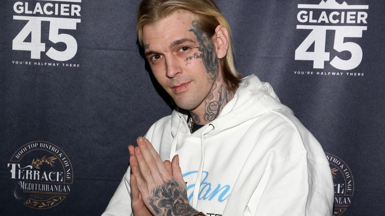 Aaron Carter posing with prayer hands