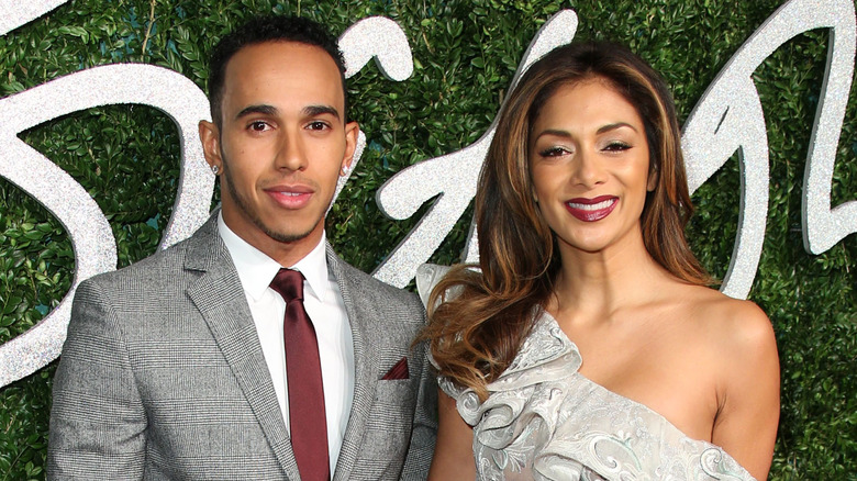 Nicole Scherzinger and Lewis Hamilton smiling