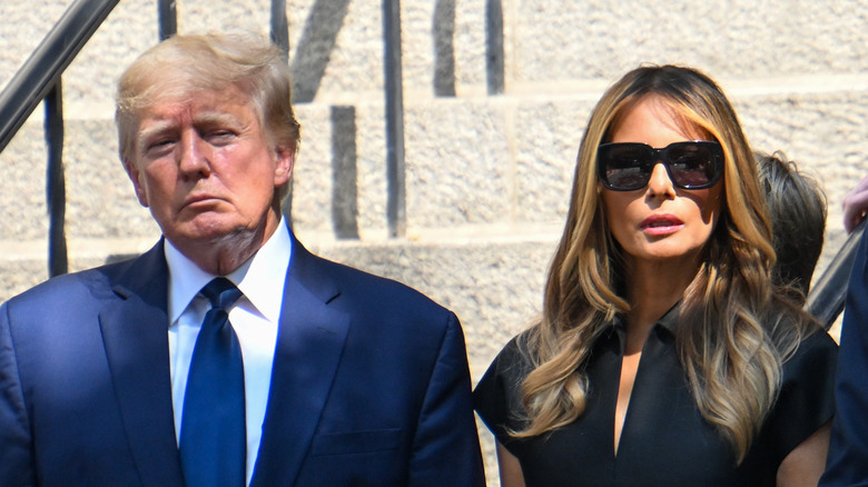 Melania and Donald Trump grimace