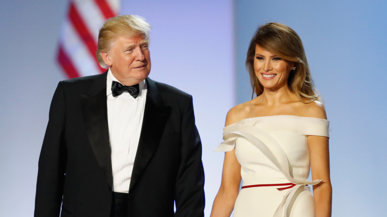 Donald and Melania Trump holding hands