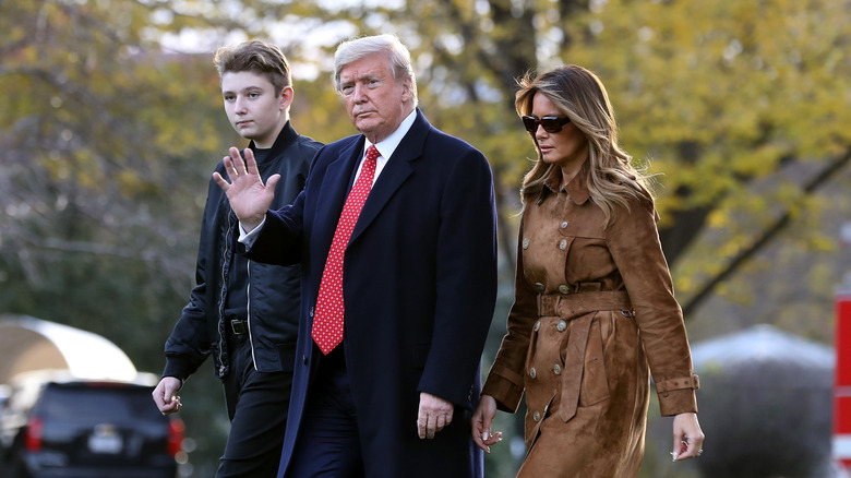 Melania, Donald, and Barron Trump walk together