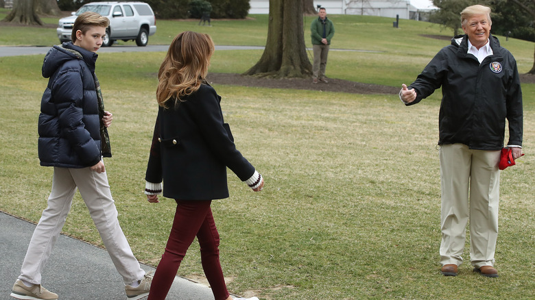 Barron, Melania, and Donald Trump walking