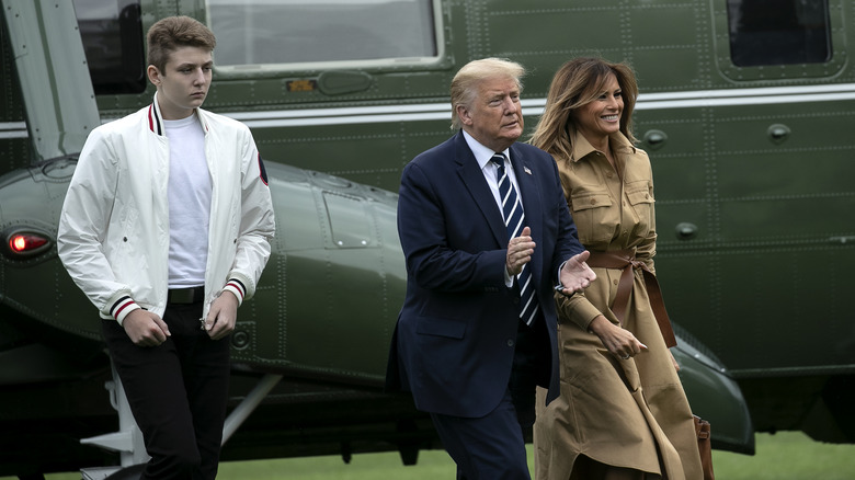 Barron, Donald, and Melania Trump walking