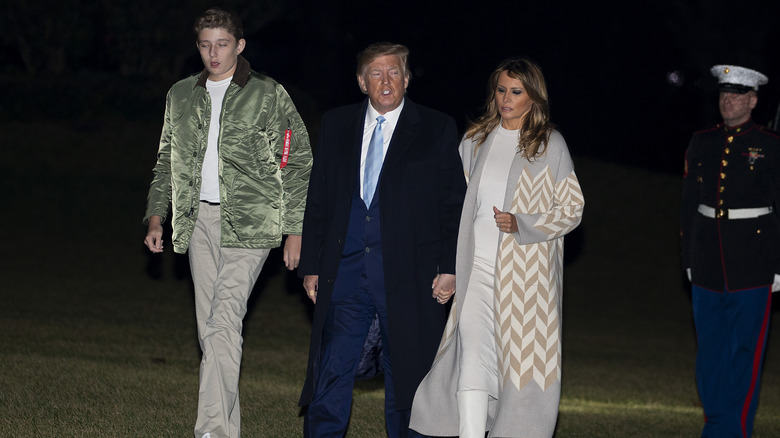 Barron, Donald, and Melania Trump walking