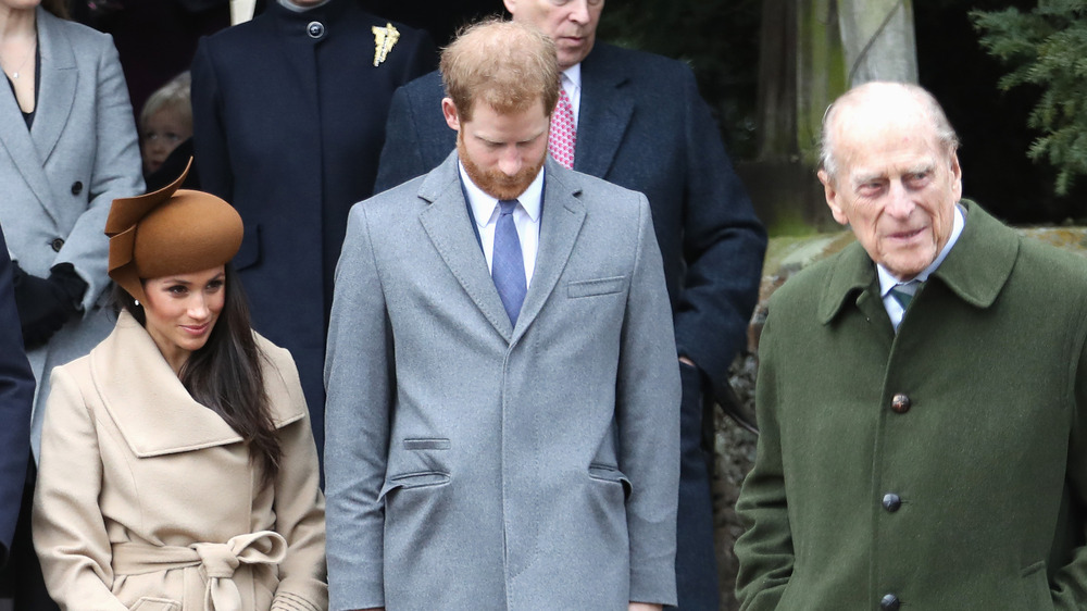 Meghan Markle, Prince Harry, and Prince Philip outside