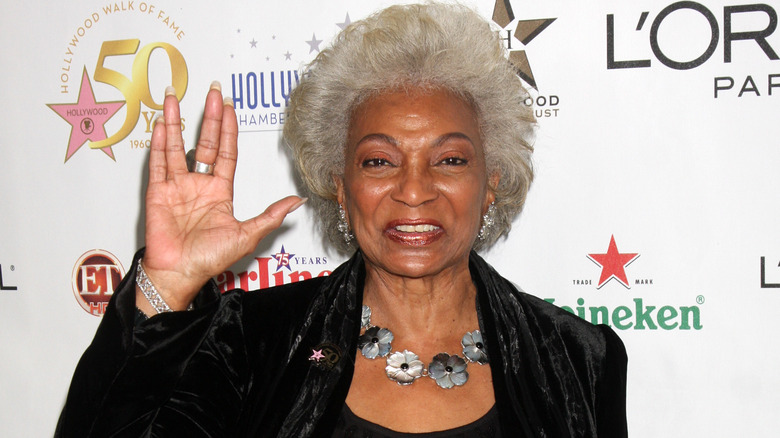 Nichelle Nichols making a Vulcan salute