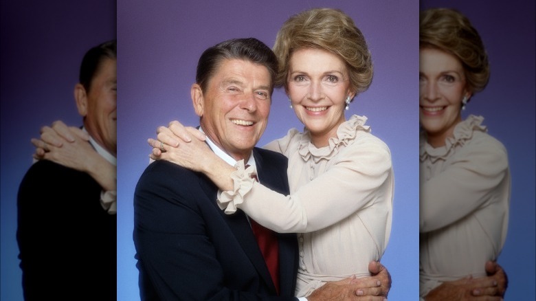 Nancy Reagan with arms around Ronald Reagan