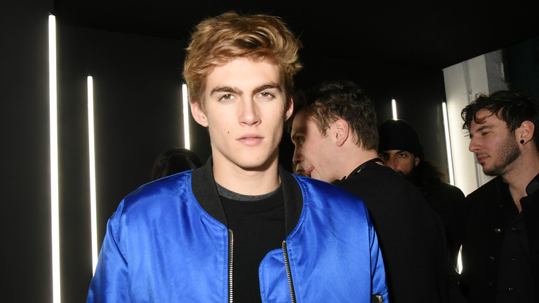 Presley Gerber attending a YSL party in a blue jacket