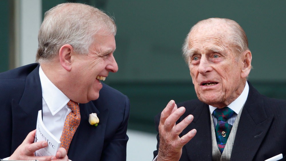 Prince Andrew and Prince Philip talking