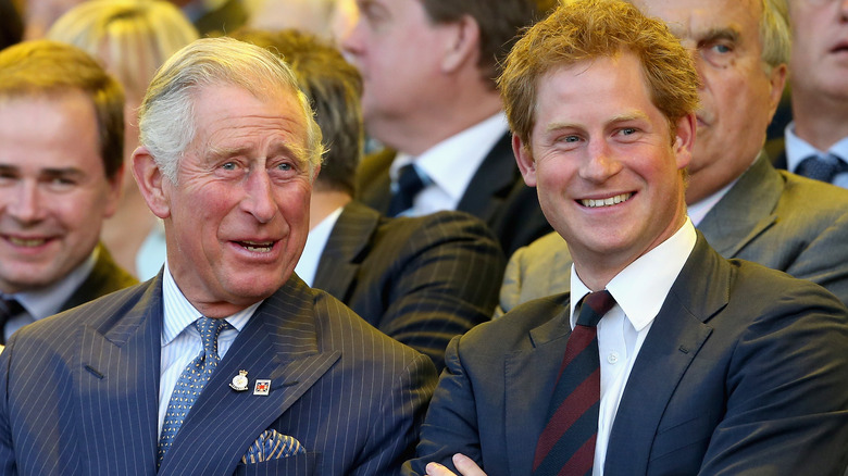 Prince Charles and Prince Harry smiling