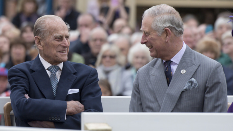 Prince Charles and Prince Philip smiling
