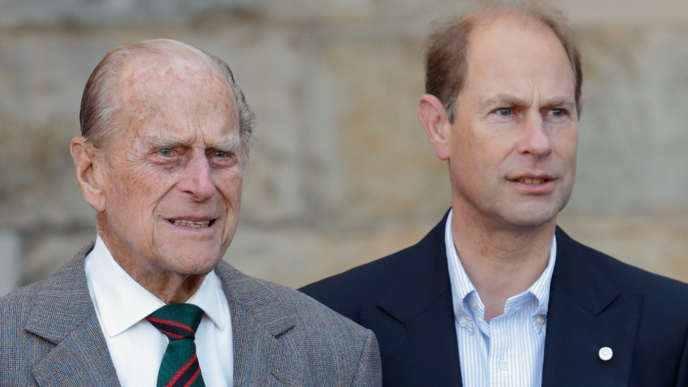 Prince Philip and Prince Edward staring