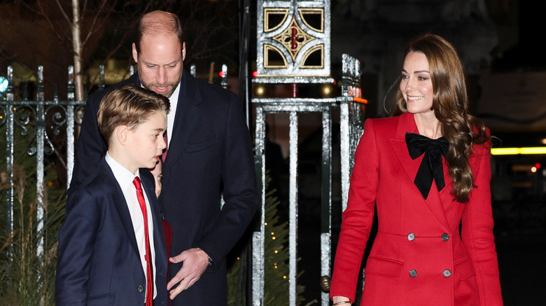 Prince George walks into the 2024 "Together at Christmas" service with his parents.