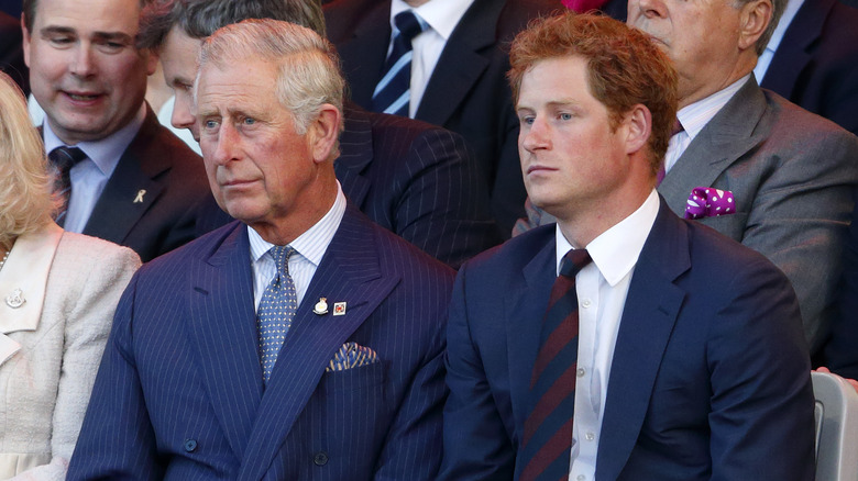 grim-faced King Charles, Prince Harry