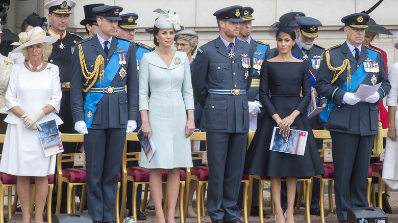 Royal family members standing