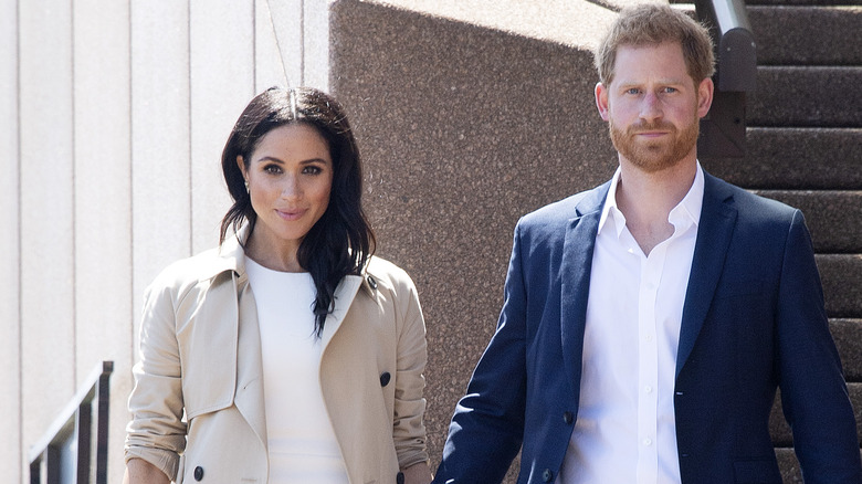 Meghan Markle and Prince Harry on stairs