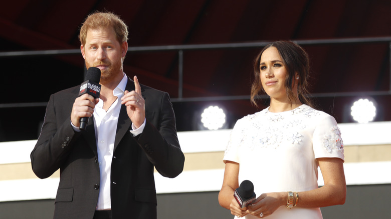 Prince Harry, Meghan Markle speaking on stage